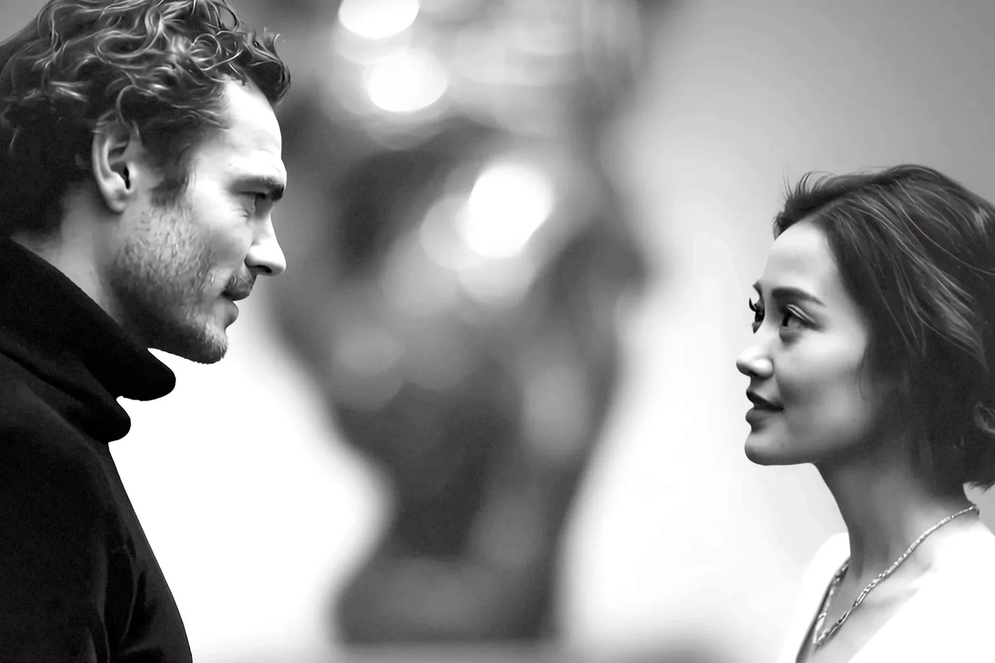 A man and woman facing each other in the finished Glenmede campaign film