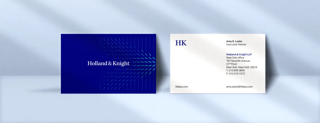 Holland & Knight business cards using the blue radiating pattern