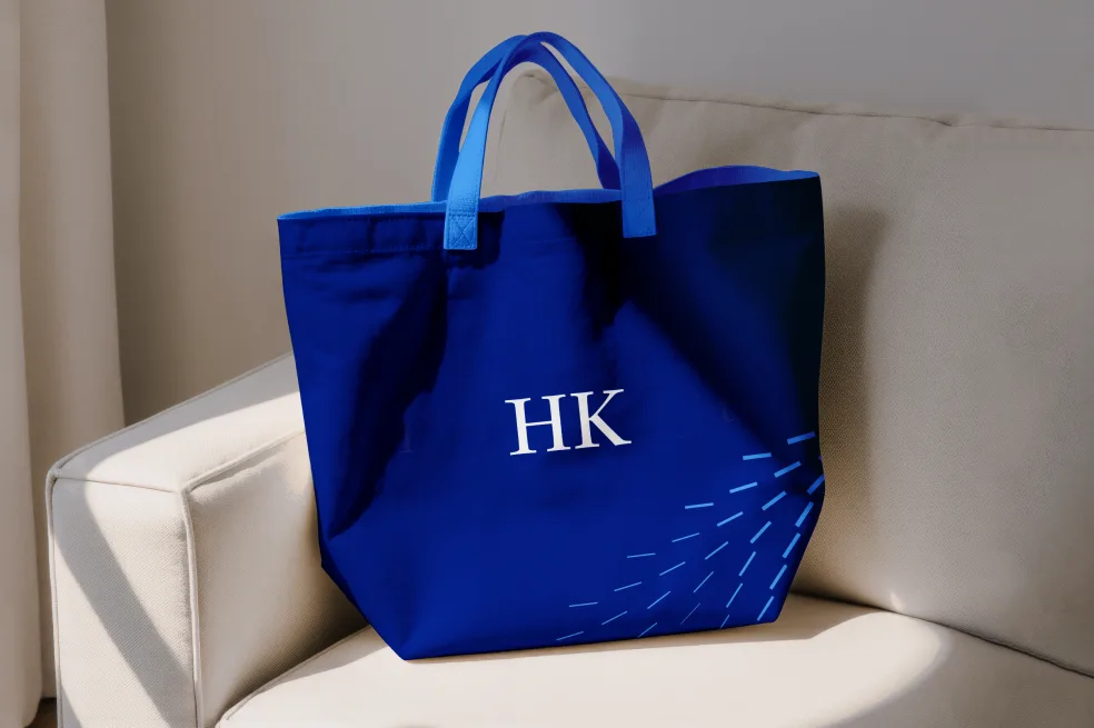 Blue Holland & Knight tote featuring the HK monogram and radiating line pattern