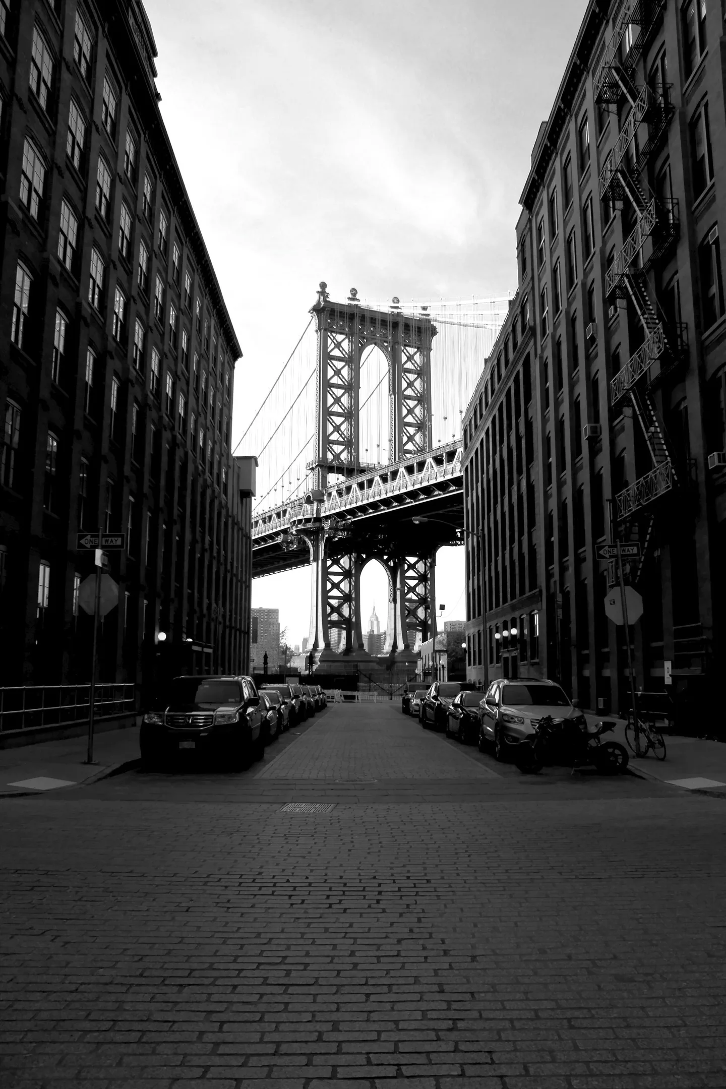 Manhattan Bridge framed by buildings in Brooklyn