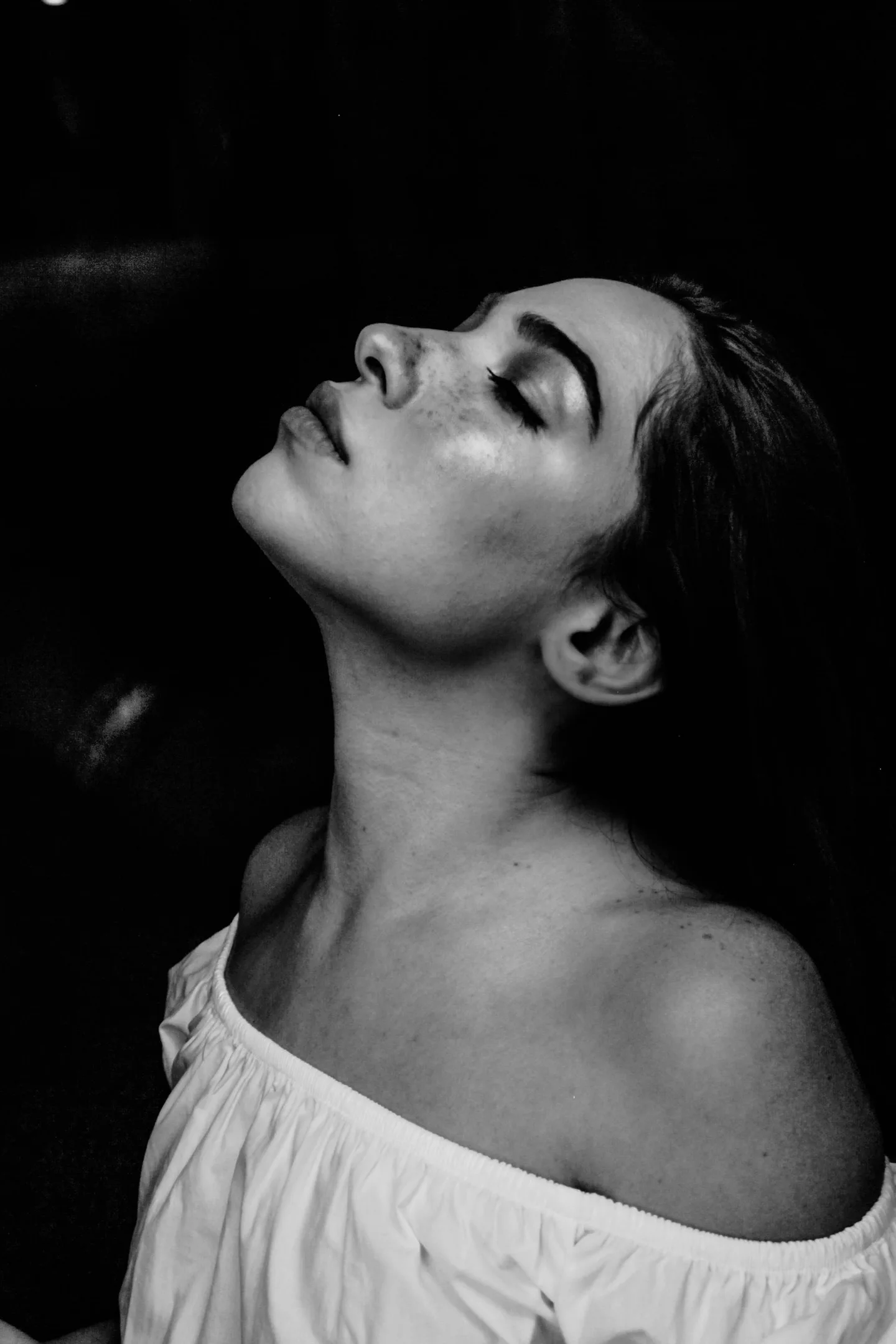 High-contrast profile portrait against a black background